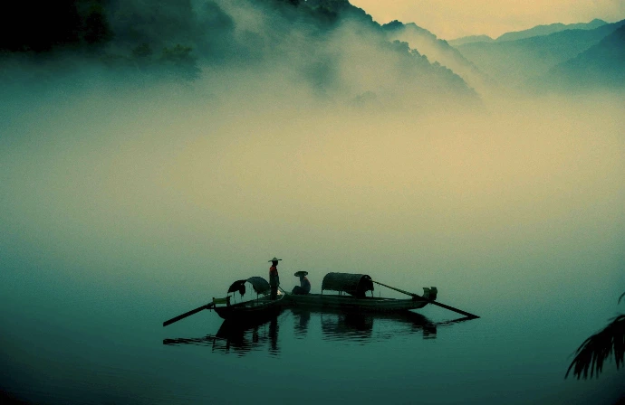 two persons riding on boats
